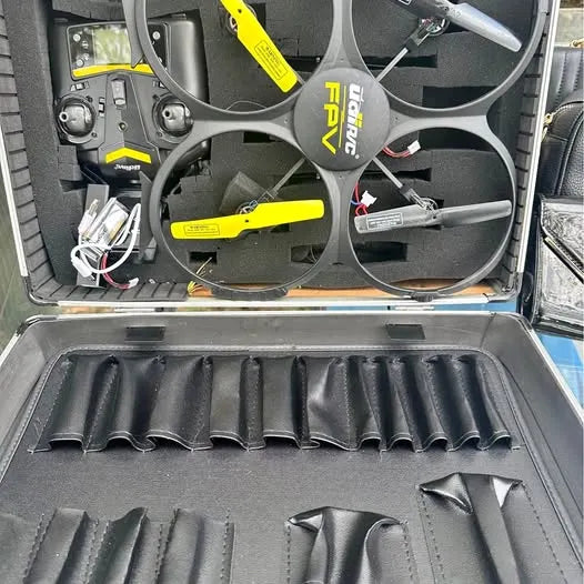 Folded drone in open protective case with propellers and rotor guard