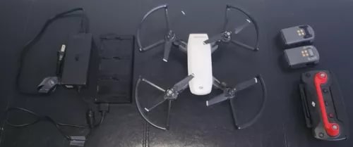 White DJI Spark drone kit with extra batteries and accessories