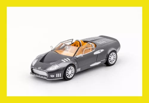 Grey diecast supercar model with orange interior, front 3/4 view