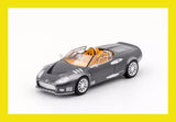 Grey diecast supercar model with orange interior, front 3/4 view