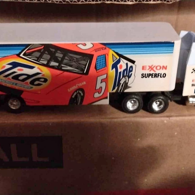 Diecast NASCAR tractor trailer with red #5 race car and white Exxon Superflo trailer.
