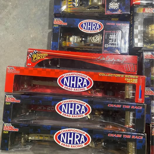NHRA diecast collectible lot in stacked red and blue blister boxes, three cars shown
