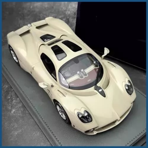 Cream alloy sports diecast car model with black accents, side view, sound and light features