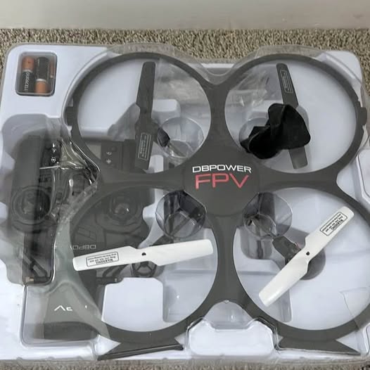 DBPOWER FPV drone with four propellers, in protective packaging set