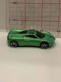 Green diecast toy sports car with black wheels and hood scoop