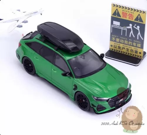 Green 1/18 scale diecast wagon car model with black roof, front 3/4 view