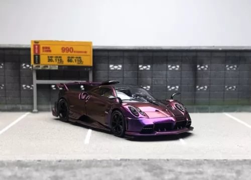 Purple and black racing sports diecast model car with rear wing