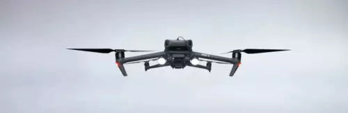 DJI drone spotlight lamp mounted on quadcopter with front camera pod