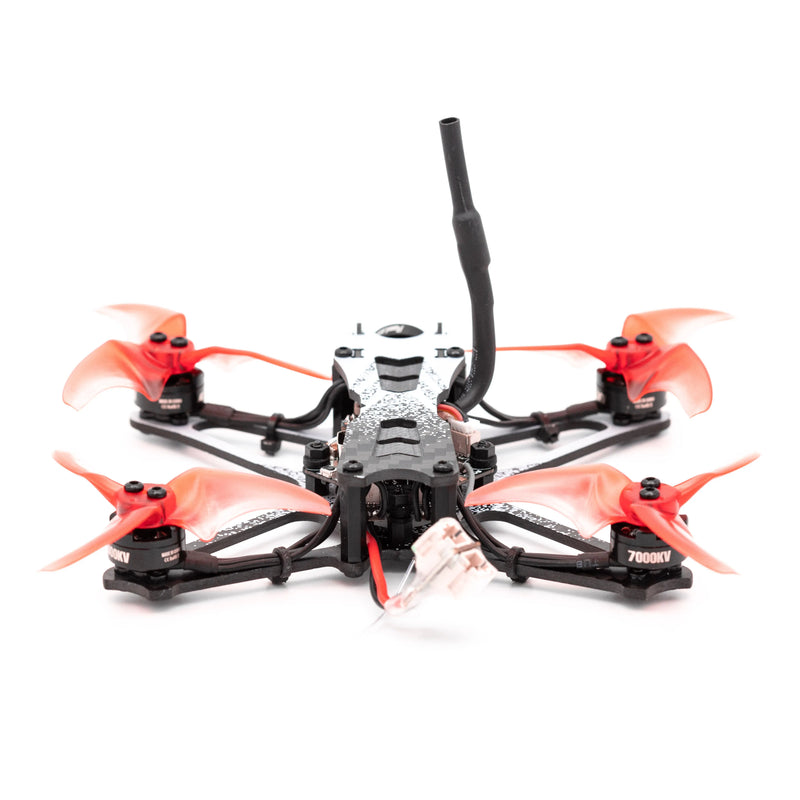 FPV racing RC quadcopter drone with orange propellers, black frame, top antenna