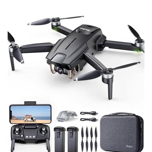 Mini drone kit with black quadcopter, controller, batteries, propellers, and carrying case
