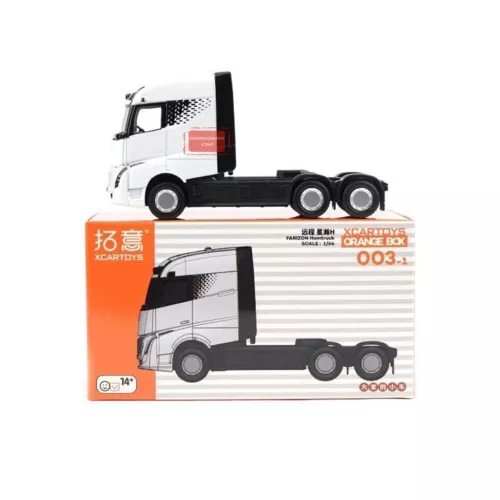 White and black diecast homtruck truck model in orange and gray box