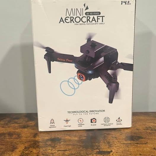 Mini drone with camera on retail box packaging