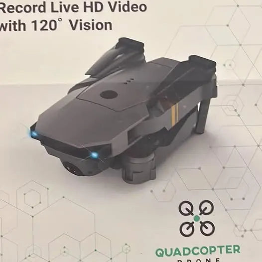 Quadcopter drone in dark gray with visible prop guards and landing feet