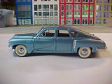 Light blue 1948 Tucker diecast model car, 1:24 scale, side profile