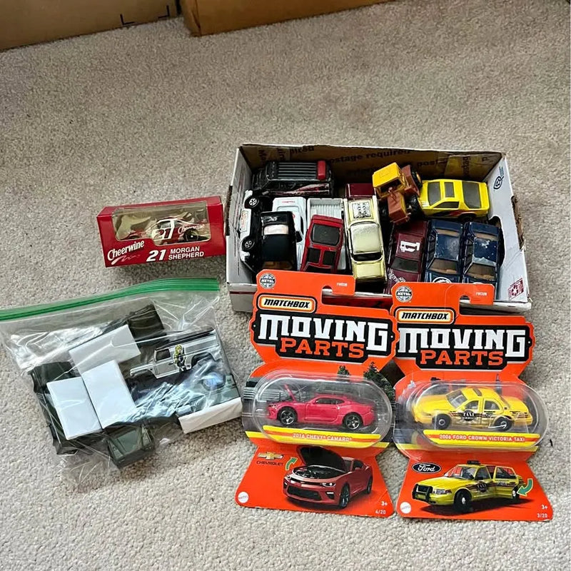 1/64 diecast car lot with multiple vehicles in open packaging