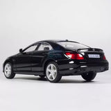 Black diecast model car with rear lights, silver wheels and Mercedes CLS63 AMG badge