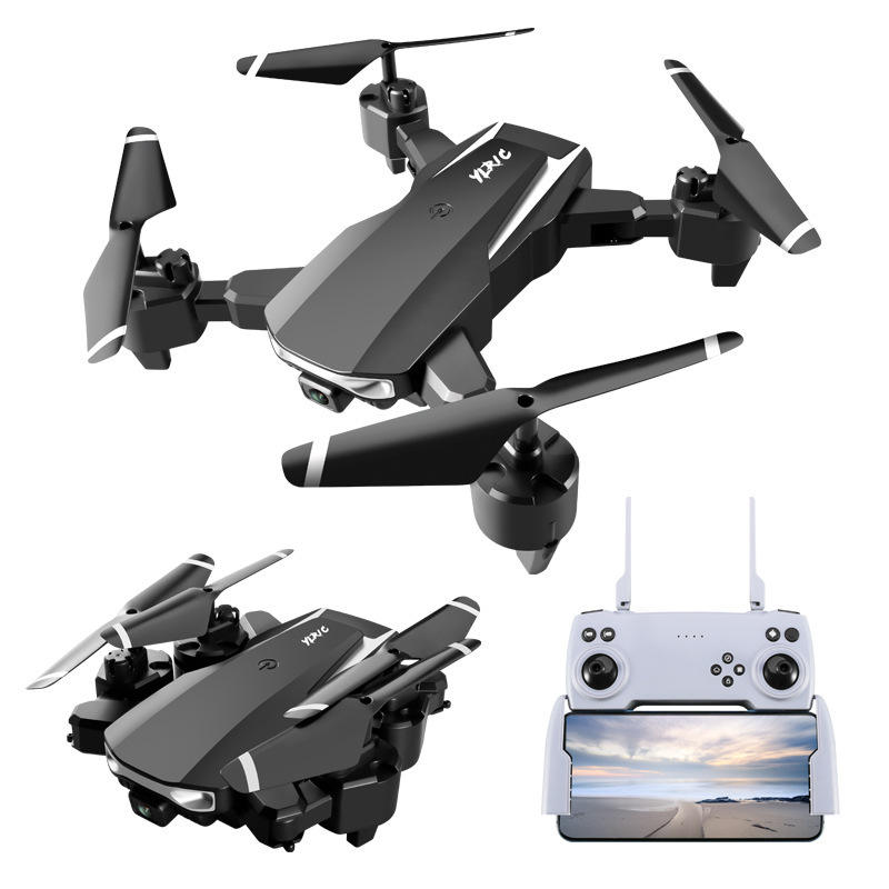 Foldable quadcopter drone with dark gray body and front camera, shown with RC controller screen