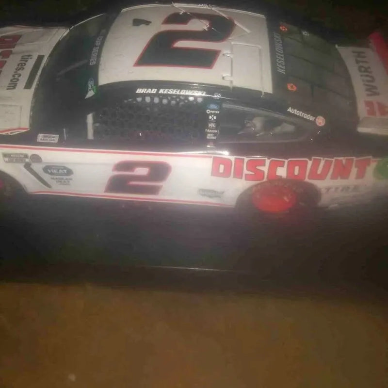 Diecast race car with white body, red #2 and DISCOUNT graphics