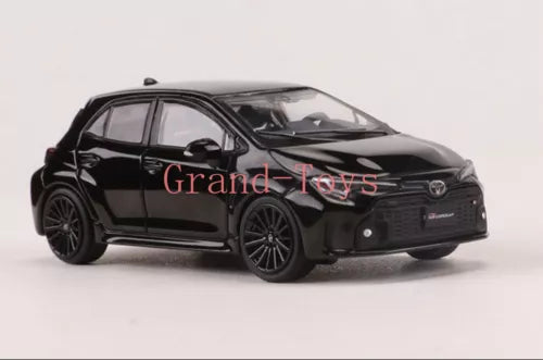 Black 1/64 diecast model car toy, Toyota GR Corolla, front 3/4 view.