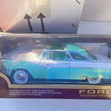 Light blue diecast model car with teal hood and FORD grille detail