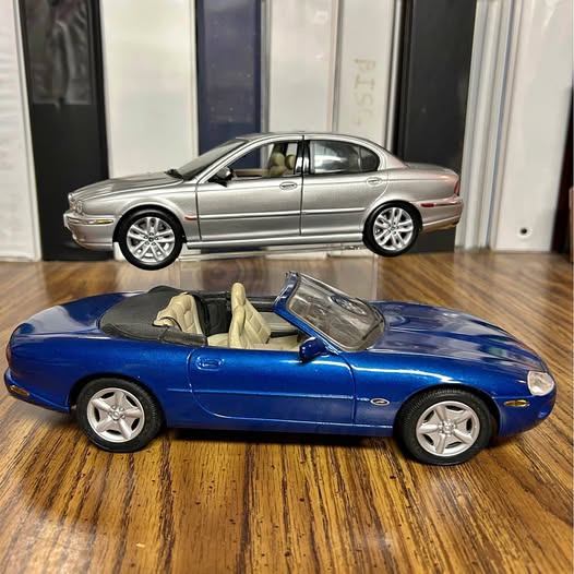 Diecast car set with blue convertible and silver coupe, both on display
