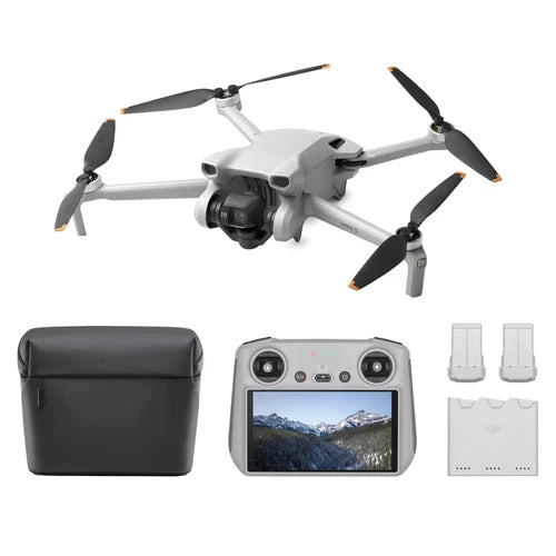 DJI quadcopter drone with white body, front camera, four propellers, controller screen and bag