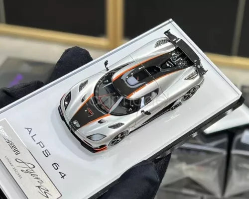 1:64 scale silver racing sports diecast car model in display case