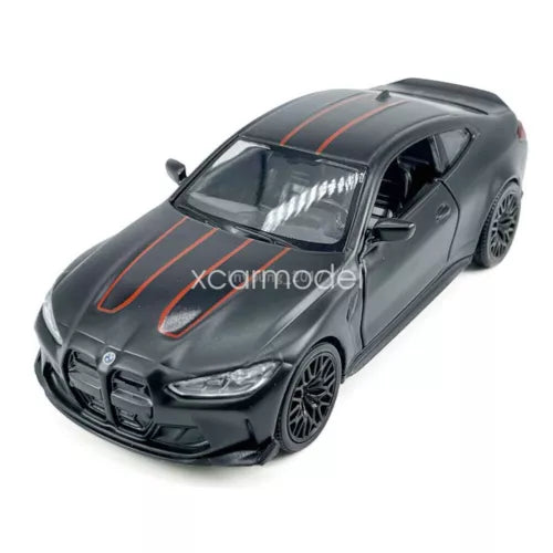 1:36 diecast sports car model, dark gray with orange racing stripes, front 3/4 view