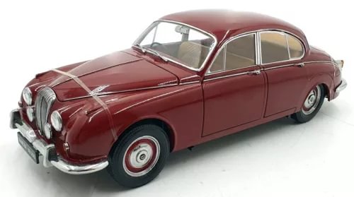 Red classic diecast coupe car model with chrome grille, front three-quarter view