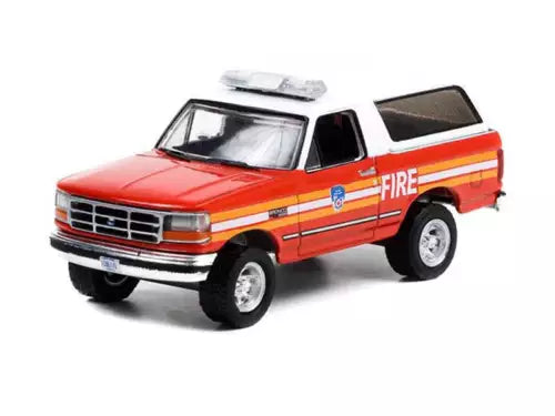 FDNY fire truck diecast model, red with orange stripe, front 3/4 view