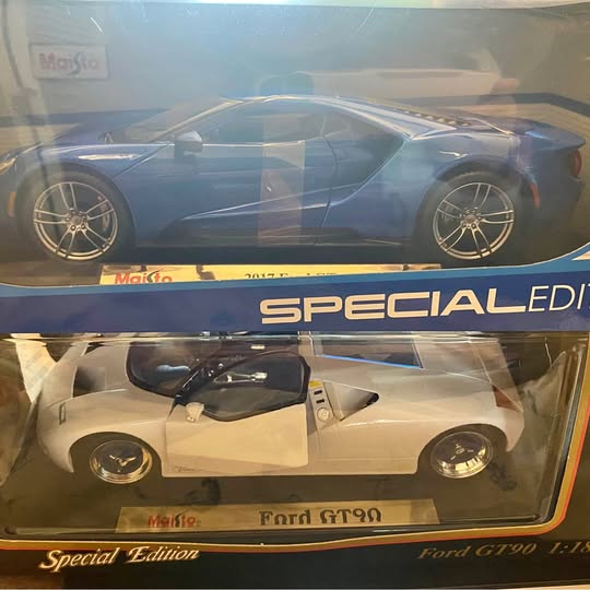 Diecast Ford GT model in display box, blue and white.