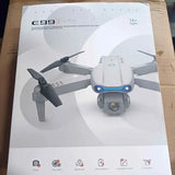 Foldable quadcopter drone with front camera and blue light accents