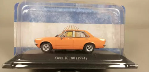 Orange 1974 Opel K 180 diecast model car in clear display case