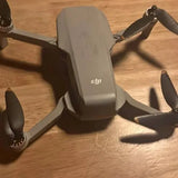 DJI Mini 2 SE drone with folded arms and visible propellers