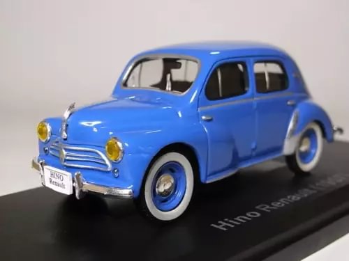 Blue vintage diecast mini car model with chrome grille and whitewall tires
