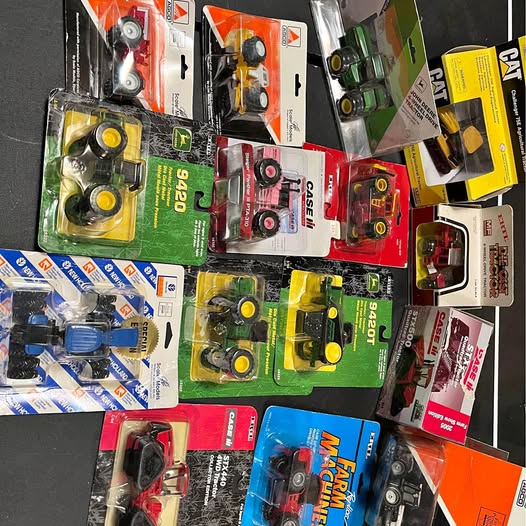 Assorted 1/64 diecast 4x4 tractors in retail blister packaging