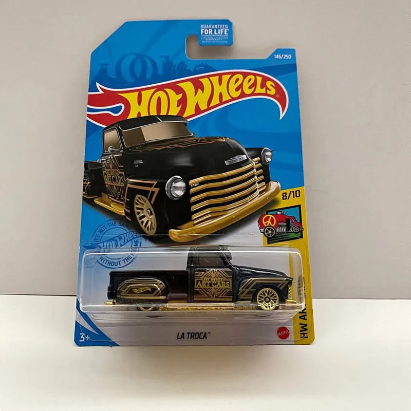 Black and gold die-cast hot rod truck toy, La Troca on blister pack