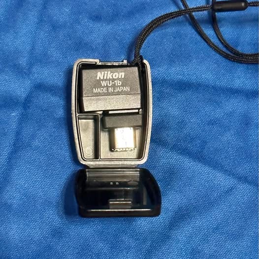 Nikon WU-1B wireless mobile adapter, with case, labeled MADE IN JAPAN