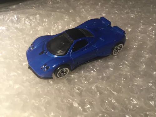 Blue diecast sports car, 1/64 scale