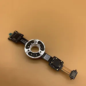 Drone gimbal motor lower bracket with circular metal mount and ribbon cable
