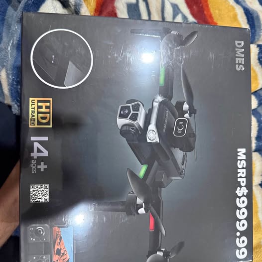Sealed drone retail box with controller graphic and green status light