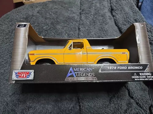 Yellow 1:24 diecast Ford Bronco pickup model by Motor Max in box