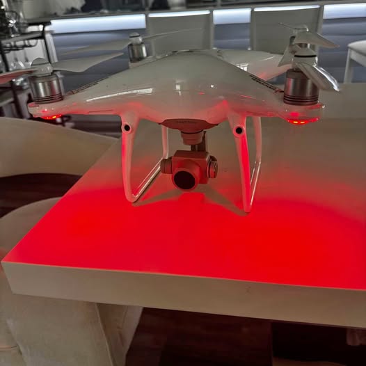 DJI Phantom 4 Pro Plus quadcopter drone with front camera and red LEDs