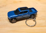 Blue diecast pickup truck keychain with metal key ring