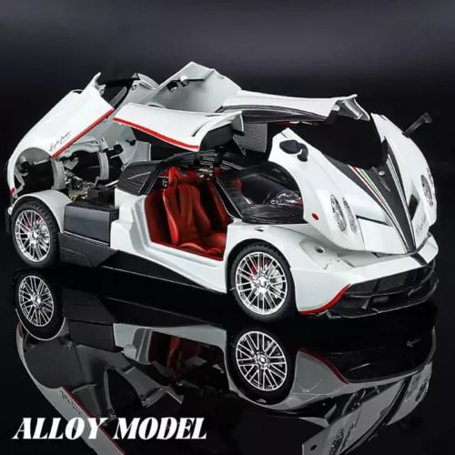 White diecast alloy sports car model with red interior, open hood, front 3/4 view