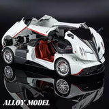 White diecast alloy sports car model with red interior, open hood, front 3/4 view