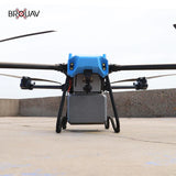 Delivery drone with blue body and four rotors, landing legs and cargo bay
