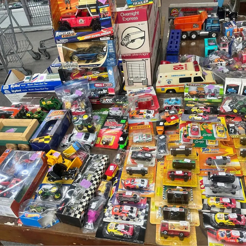 Metal diecast car, truck, and tractor assortment in retail packaging with mixed colors