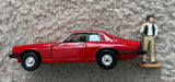 Diecast toy car replica, red Jaguar XJS with standing figure