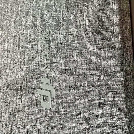 DJI-branded gray textured fabric case